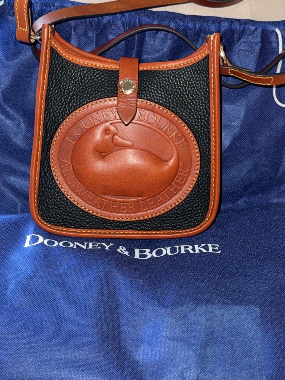 Dooney & Bourke Black Pebbled Leather Crossbody with Brown Trim. Heritage Duck